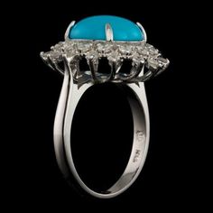 3.90 Carats Impressive Natural Turquoise and Diamond 14K Solid White Gold Ring Total Natural Oval Turquoise Weight is: Approx. 3.20 Carats Turquoise Measures: 12.00 x 10.00mm Natural Round Diamonds Weight: Approx. 0.70 Carats (color G-H / Clarity SI1-SI2) Ring total weight: 5.3 grams Disclaimer: all weights, measurements and colors are approximate and may vary slightly from the listed dimensions or as seen in the image. All pictures are magnified to show the smallest of details. Please, refer to Luxury Turquoise Jewelry With Center Stone, Elegant Blue Turquoise Ring With Center Stone, Luxury Blue Turquoise Ring For Formal Occasions, Elegant Turquoise Multi-stone Rings, Luxury Turquoise Jewelry For Anniversary, Fine Jewelry Turquoise With Halo Setting, Elegant Turquoise Diamond Ring With Center Stone, Oval Diamond Turquoise Ring For Formal Occasions, Formal Oval Turquoise Ring With Diamond