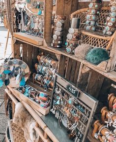 an outdoor market with lots of jewelry on display