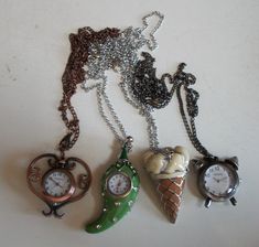 ICE CREAM CONE Number dial with hour, minute and second hands Total  Length with Close Chain: As you wear in neck is 14" aprox Dial diameter 16 mm, Total width 24 mm Cone length 48 mm New battery installed  No box No display included  HEART Chain Length: 32" & Pendant 1.75" aprox with loop No box No display included CHILLIE Total  Length with Close Chain: As you wear in neck is 15" aprox Dial diameter 15 mm New battery installed  No box BELL LOOK Total  Length with Close Chain: As you wear in ne Slow Gin Fizz, Cute Necklaces, Dress Creator, Funky Glasses, Heart Chain, Watch Chain, Jewelry Accessories Ideas, Funky Jewelry, Watch Necklace