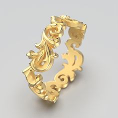 a gold ring with an intricate design on it