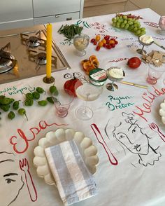 a white table topped with lots of food