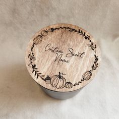 a small wooden box with an engraved message on the lid that says, create sweet memories