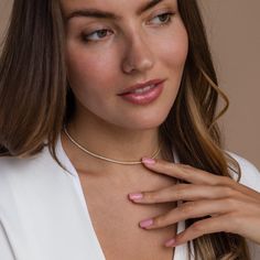 Give the gift of sparkle this holiday season with our Diamond Tennis Choker Necklace. Featuring dazzling diamond gemstones on a delicate chain, this versatile piece adds elegance to any look—from casual outings to glamorous date nights. A perfect Christmas gift to make someone shine. SKU: RR-NR152 Product Details Finish/Material: 18K Gold Over Brass ∙ White Gold Over Brass, CZ Diamond Gemstones Featuring a Dainty ~2mm CZ Diamond Tennis Choker Necklace, available in 2 lengths: 14 Inches + 2 Inch Christmas Gift To Make, Caitlyn Minimalist, Tennis Choker Necklace, Gold Bridal Jewelry, Sideways Initial Necklace, Dainty Diamond Necklace, Diamond Huggies, Art Deco Diamond Rings, Silver Pearl Necklace