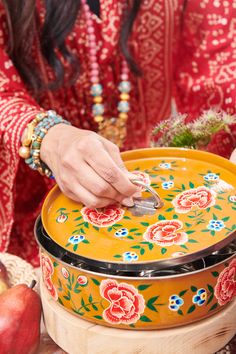 Hand painted by Kashmiri artisans, our custom crafted collection of stainless steel spice tins put a modern twist on traditional Indian brushwork. Fill with anything from essential spices to tea blends. We especially love these for organizing baking supplies, separating craft materials, serving tortillas and rotis at the table, or gifting homemade treats. Rest on the countertop for a blooming bohemian vibe in the kitchen or stash away as colorful pantry storage. Tins are sold individually. Choose pattern and color options from the drop-down menu. Measures 9 x 3 inches. Interior storage includes one mini spice spoon and seven steel storage cups 2 x 3 inches each. Ring top lid rests lightly on top for easy access. Cups can be removed for multi-purpose use. Care: Gently hand wash painted tin Organizing Baking Supplies, Colorful Pantry, Essential Spices, Spice Tray, Spice Spoon, Indian Things, Spice Bowls, Spice Tins, Steel Storage