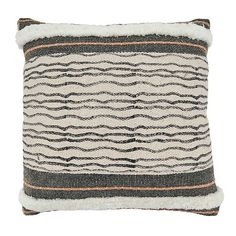 a black and white striped pillow with fringes on the front, sitting against a white background