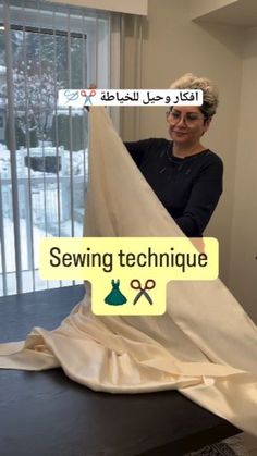 a woman is sewing fabric on a table in front of a window with the words sewing technique written above it