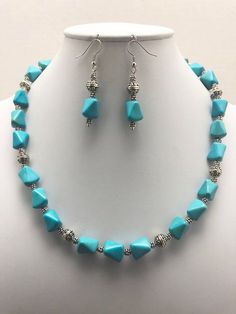 DESCRIPTION:  This beaded necklace features a single strand of beautiful bright blue colored turquoise howlite nugget beads. The  turquoise howlite nugget beads are combined with lovely textured tibetan-style silver round beads for variety and interest. Tiny textured silver beads are also beaded in the necklace design for an additional detail and to provide adequate spacing between the turquoise howlite nugget beads. The necklace is finished with a silver s hook clasp (see the fifth photo).  Tur Blue Turquoise Howlite Necklace With Round Beads, Beaded Turquoise Howlite Necklace, Blue Beaded Howlite Necklaces, Blue Howlite Beaded Necklaces As Gift, Blue Howlite Beaded Necklace For Gift, Turquoise Howlite Beaded Necklace With Gemstone Beads, Turquoise Howlite Gemstone Beaded Necklaces, Turquoise Howlite Gemstone Beaded Necklace, Adjustable Blue Howlite Necklaces