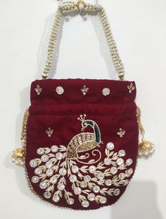 This beautiful Potli or batawa bag are eye catchy and made of premium material. Key Features: Potli Bag Dimension --- 10*8 Inches Embroidery art work This potli is good match with both Indian and western outfits and are superb for wedding and festive parties This would be best complement to your designer saree, lenhga or any other kind of dress This is the combination of traditional and modern embroidery work This is enough to keep your accessories and all needed essentials and it can be a best Traditional Handwork Potli Bag For Diwali, Traditional Diwali Potli Bag With Handwork, Gold Pouch With Latkans For Festivals, Elegant Gold Potli Bag With Pallu, Bollywood Style Bag With Latkans For Gift, Elegant Festival Pouch With Latkans, Elegant Bags With Latkans For Gifts, Traditional Potli Pouch Bag, Traditional Handmade Potli Bag For Festivals