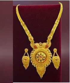 Elevate your style with this exquisite 22K gold plated traditional necklace set, perfect for special functions, weddings, or festive occasions. Designed with intricate craftsmanship, this necklace set reflects the beauty of Indian bridal jewelry. The vibrant golden hues and detailed motifs make it an ideal choice for a regal look. This set includes matching earrings to complete your ensemble, making you stand out in any celebration. The lightweight design ensures comfort without compromising ele Round 22k Gold Temple Necklace As Gift, Gold Plated Yellow Gold Kundan Necklace For Puja, Gold Meenakari Temple Jewelry Sets, Gold Plated Jewelry Sets For Puja, Gold-plated Jewelry Sets For Puja, Gold Jewelry With Meenakari For Puja, 22k Yellow Gold Jewelry Sets For Puja, Gold Jewelry Sets For Diwali Festival, Temple Jewelry Gold Jewelry Set For Puja