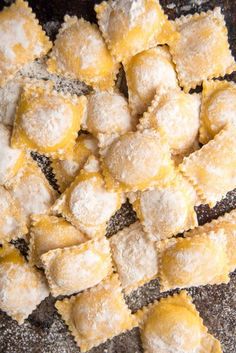 some kind of food that is sitting on a table and has powdered sugar on it