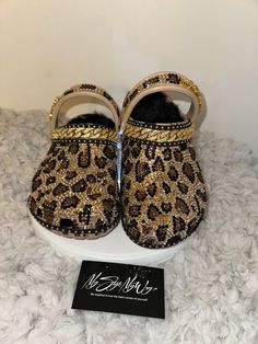 "MyStyleMyWay's  custom crocs are designed for the perfect outfit, that special occasion, and \"Just Because\" you love blinged out crocs.  In the display shown we designed a pair of tan \"Cheetah Print Design\" classic crocs adding high quality colorful rhinestones. 🐆Each Rhinestone is individually and neatly placed to achieve the design.  🐆Rhinestones are added to the top and buttom trimming of the shoe.  🐆This design was personalized. 🐆The sports mode strap is also designed.   🐆Fur Lining is included in this design  🐆This design do not have charms or patches. charms can be added please contact us directly to discuss charm options.  🐆When making your purchase - You're making a purchase for the exact style shown. If you would like a different color rhinestone,  and or different cha Leopard Crocs With Charms, Cheetah Crocs, Blinged Out Crocs, Bedazzled Crocs, Crocs With Charms, Cheetah Print Design, Womens Clogs And Mules, Classic Crocs, Custom Crocs