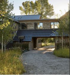 a large wooden house with a metal roof