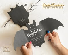 someone is cutting out a bat shaped halloween party card with the words, you've got to do it right now