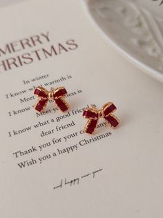 🫧 Christmas Bow Earrings 🫧 Earrings are made from Pure S925 18K Gold Plated  🤍  P E R F E C T  G I F T  F O R  H E R  🤍 * Christmas bow Earrings  * Meticulous attention to detail * hypoallergenic, nickel free & safe for sensitive skin * Perfect for bridal earrings, bridesmaid earrings or for everyday wear. 🤍 P R O D U C T - D E T A I L S 🤍 * Material: Pure 925 Silver,  * Plated: 18K Gold 🤍 W H A T ' S  I N  T H E  B O X 🤍 * Our Jewelry  * Silver Polishing Cloth * Alcohol Pads * Greeting Cheap Gold Christmas Earrings, Christmas Jewelry Aesthetic, Red Bow Earrings, Christmas Earrings Aesthetic, Elegant Valentine's Day Earrings For Festive Occasions, Elegant Valentine's Day Festive Earrings, Elegant Christmas Anniversary Earrings, Round Earrings For Christmas Anniversary, Gold Jewelry With Matching Earrings For Holiday