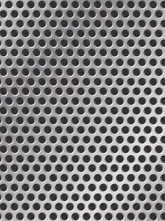 a metal background with holes in the middle