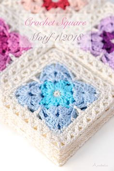 three crocheted squares with flowers on them