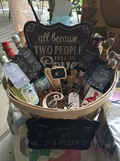 a basket filled with lots of different types of bottles and liquors on top of a table