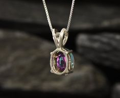 Mystic Topaz Pendant set with a Natural Mystic Topaz in a diamond cut, flawless clarity & purple/green colour, from Brazil, at 10x8mm, 3 Carats. Oval Pendant design made of Solid 925 Sterling Silver ☞ made to last Free Silver Chain with every Pendant order, 18 inch Silver chain (46 cm) ✓ Matching Ring: www.etsy.com/uk/listing/718725581 Matching Earrings: www.etsy.com/uk/listing/705259786 December Birthstone - Genuine & Natural Stones ❀ Details : ♥ Each item packaged in a cute GIFT BOX ✓ ♥ GUARAN Mystic Topaz Necklace, December Gift, Purple Pendant, Rainbow Topaz, Purple Diamond, Topaz Pendant, Dainty Pendant, Topaz Necklace, Matching Ring