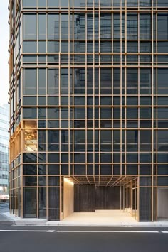 an empty parking lot in front of a tall building