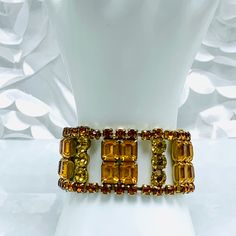 1960's Yellow Rhinestones Statement Bracelet Old Hollywood Glamour Yellow,Citrine,Golden Amber Rhinestones Gold Tone Pronged Safety Latch What an Impressive Bracelet Full Beautiful Rhinestones In Different Sizes and Shapes See Pictures For Measurements Fully Extended It Measures 7 Inches No Missing Or Loose Rhinestones In Good Condition Does Have Some Wear On The Latch But that is to be Expected How Can You not Wear This Gorgeous Bracelet Retro Jeweled Bracelet For Formal Occasions, Retro Jeweled Bracelets For Formal Occasions, Vintage Gold Jeweled Crystal Bracelet, Vintage Gold Crystal Bracelet For Party, Retro Gold Bracelets For Party, Yellow Rhinestone Jewelry For Party, Retro Gold Party Bracelets, Yellow Rhinestone Party Jewelry, Gold Crystal Bracelet For Party