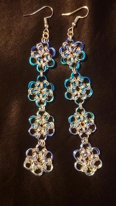 Handmade chainmaille earrings using Japanese 12 in 2 weave. Made with anondized aluminum bright aluminum jump rings. 5 shades of blue. Chainmaille Jewelry Patterns, Chainmaille Earrings, Chainmaille Jewelry, Japanese Flower, Chain Maille Jewelry, Japanese Flowers, Blue Gradient, Chain Mail, Earrings Blue