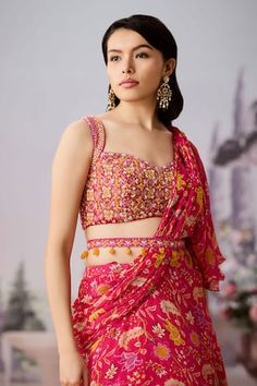 Fuchsia pre-draped ruffle saree with floral chintz printed base. Comes with embroidered padded blouse, embellished by beads and sequins. Paired with jewel embellished belt. - Aza Fashions Pink Draped Sets With Zari Work, Pink Draped Lehenga With Dupatta, Festive Draped Pink Lehenga, Pink Draped Choli With Unstitched Blouse, Traditional Pink Draped Lehenga, Traditional Draped Pink Lehenga, Pink Draped Set For Festive Occasions, Pink Draped Sets For Festive Occasions, Festive Draped Pink Set