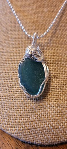 This piece of Maine sea glass is a gorgeous teal blue and handcrafted in sterling silver. This color isn't found very often. The pendant comes with a 24" silver plated chain (as shown) and gift box. Shipping is included. Silver Glass Jewelry For Keepsake, Silver Glass Gemstone Jewelry, Silver Glass Jewelry With Gemstone, Unique Silver Jewelry With Recycled Glass, Turquoise Recycled Glass Jewelry For Jewelry Making, Silver Sea Glass Necklace With Wire Wrapped Detail, Turquoise Recycled Glass Jewelry For Crafting, Wire Wrapped Silver Sea Glass Necklaces, Wire Wrapped Silver Necklace With Sea Glass