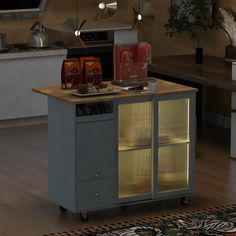 a kitchen island with drinks on it in the middle of a floored room next to an oven