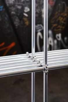 the metal bars are attached to the wall