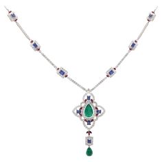 Cast from 18-karat gold, this exquisite necklace is hand set with 6.57 carats Emerald, Blue sapphire and 4.17 carats of sparkling diamonds. FOLLOW MEGHNA JEWELS storefront to view the latest collection & exclusive pieces. Meghna Jewels is proudly rated as a Top Seller on 1stDibs with 5 star customer reviews. All items manufactured by us are handmade and can be customized or redesigned. Certificate of authenticity available upon request. Composition Gross Weight: 23.54 Grams Gold Net Weight: 21.40 Grams Diamond Weight:- 4.17 Carats Diamond Quality: FG--SI Emerald & Blue Sapphire Weight:- 6.57 Carat Necklace Length: 16 Inches Luxury Sapphire Necklace Hallmarked, Luxury Sapphire Necklace With Diamond, Exquisite Diamond Multi-stone Necklaces, Luxury Sapphire Necklace With Brilliant Cut, Luxury Sapphire Pendant Necklace, Luxury Sapphire Gemstone Diamond Necklace, Elegant Sapphire Multi-stone Necklace, Multi-stone Diamond Necklace In Fine Jewelry Style, Luxury Sapphire Gemstone Necklace