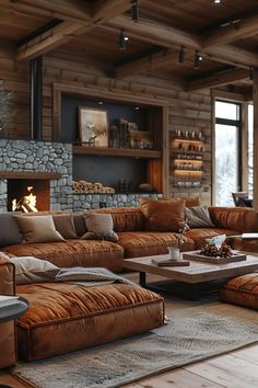 a living room filled with lots of furniture and a fire place in the middle of it