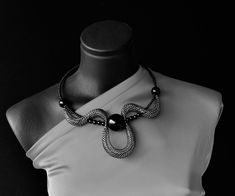 "Statement black and silver collar, Short elegant necklace, Contemporary necklace, Unusual necklace, Fashion necklace, Modern necklace, Chic necklace. Statement eye catching black and silver necklace, Contemporary choker necklace. Attractive stylish modern collar.  Light and comfortable to wear, easy to combine with many outfit styles. Bold necklace for those who love bohemian style. Necklace Is very comfortable and on memo wire so you can wear it as choker, or as classic necklace when you lock