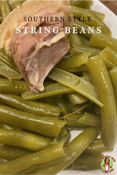 some green beans and ham on a white plate with the words southern style string beans