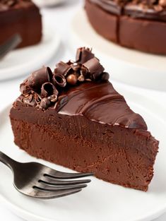 a piece of chocolate cake on a plate with a fork