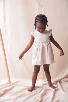 With its %100 Cotton airy double-layered texture , this dress is exactly for summer. It is one of my favorite products that children wear with love. It is very easy to put on and take off thanks to the studs located on the back. The length of the dress is above the knee. Easy to wear. All materials used are Oeko-Tex Certified to protect children's health. It will be sewn immediately after the order has been placed and sent to you no later than 5 working days. Moreover, the little one who is waiting for the sweet girls next to her is also in for a surprise :)   For everyday or special occasions. Composition: 100% cotton Color :  Beige Latte  Available sizes: 2-3 years 3-4 years 5-6 years 7-8 years Made and designed by Siminie in Turkiye. Care instructions: Machine wash at 30o Wash with like