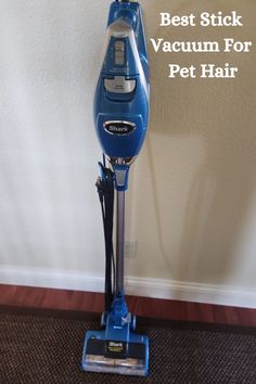 the best stick vacuum for pet hair is on display in front of a white wall