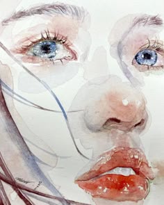 a watercolor painting of a woman's face with blue eyes