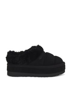 Find UGG Tazzlita Slipper on Editorialist. UGG Tazzlita Slipper in Black Quilted suede upper with rubber lug sole. Made in Vietnam Fur origin: Australia. Pull-on styling. Faux fur lining Dyed lamb collar. Uggplush ™ vamp lining and sockliner. Round toe. Water repellent. Approx 45mm/ 1.75 inch platform. UGGF-WZ67. 1146390. About the designer: Ugg Tazzlita, Kappa Slides, Chunky Slippers, Black Teddy Bear, Pretty Shoes Sneakers, Shoe Wishlist, Black Uggs, Winter Fit, Cute Tattoos For Women