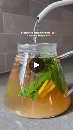 a pitcher filled with tea and lemon slices