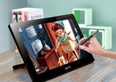 a person holding a pen and drawing on an electronic tablet with the image of a cartoon character