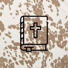 a book with a cross drawn on it and brown spots around the pages is shown