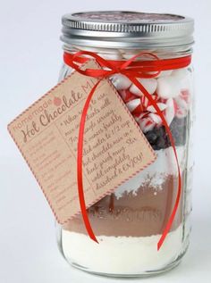 a mason jar filled with hot chocolate mix and gift in a jar for someone's birthday