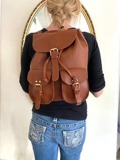 "Backpack bag, brown faux leather backpack,Converts to shoulder bag, mint condition, Whiskey brown Top loop handle for carrying Flap over and Snap clasp closure. 2 front snap close pockets PLEASE SEE MEASUREMENTS Measures: 12\" tall x 10\" x 5.5\" deep Straps: adjustable Should strap drop is 12\" NK216B3 Backpack bag, brown faux leather backpack,Converts to shoulder bag, mint condition, Whiskey brown" Casual Brown Satchel For Students, Leather Satchel Backpack With Hasp Closure, Brown Satchel For Students, Brown School Backpack With Hasp Closure, School Backpack With Hasp Closure In Brown, Leather School Backpack With Hasp Closure, School Satchel Backpack With Hasp Closure, School Backpack Satchel With Hasp Closure, Large Capacity Brown Satchel For Students