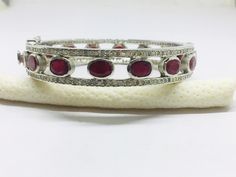 Listing is for (1) one beautiful Solid sterling silver 925 two tone pave diamond ruby bangle (price for one psc.) diamond wt: 2.1 cts. silver wt: 45 gms. stone wt: 8 cts. Gemstone name:- Diamond Ruby It's a beautiful bracelet (bangle). two tone pave diamond ruby bangle perfect for summers. Light weight . perfect for gifting and wedding. We keep on adding new products & designs every day so keep coming back to get more deals & designs. Bulk & wholesale orders are welcome on this desig Diamond Bangle Fine Jewelry Hallmarked, Oval Bangle With Diamond Accents In Fine Jewelry Style, Hallmarked Diamond Bangle Fine Jewelry, Silver Bangle With Pave Setting As Gift, Silver Bangle With Pave Setting, Silver Bangle With Pave Setting Fine Jewelry, Silver Bangle With Pave Setting In Fine Jewelry Style, Pave Setting Bangle As Gift, Fine Jewelry Ruby Diamond Bangle Bracelet