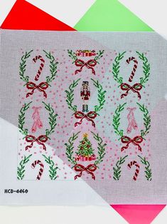 two pieces of fabric with christmas designs on them, one is red and the other is green