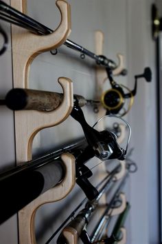 there are many fishing rods on the wall