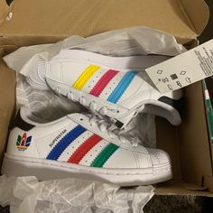 Brand New Sporty Rainbow Sneakers With Branded Insole, Multicolor High-top Sneakers For School, Rainbow Sports Sneakers With Round Toe, Rainbow Round Toe Sneakers For Sports, Rainbow Sporty Synthetic Sneakers, Playful Low-top Rainbow Sneakers, Rainbow Synthetic Sporty Sneakers, Playful Rainbow Low-top Sneakers, Adidas Multicolor Sneakers With Rubber Sole