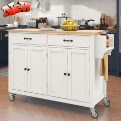 a white kitchen island with wooden top on wheels