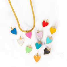 Add a colorful heart charm to your necklace! Easy to slide off and on the chain of your choice! We recommend it on our Paper Clip Chain Necklace and Bracelet or Herringbone Snake Chain Necklace! Friendship Necklace With Heart Pendant And Charm, Multicolor Charm Necklaces With Removable Charms As A Gift, Multicolor Charm Necklace With Removable Charms As Gift, Gift Multicolor Charm Necklace With Removable Charms, Nickel Free Heart Shaped Necklaces For Friendship, Nickel-free Heart-shaped Friendship Necklaces, Nickel-free Heart-shaped Necklace For Friendship, Heart Charm Necklace For Friendship, Heart-shaped Friendship Charm Necklaces