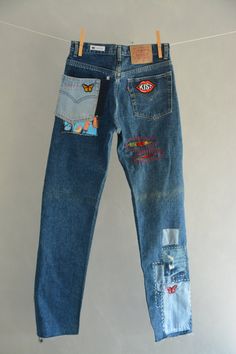 "Ready to send:Size-30 Unique vintage jeans One of a kind.. Hand made embroidery and unique patches. ---Or---- Made to order, in any size, within 6 working days . If you need different size, please send me a message and I will make you a special and unique design within 2 working days. They are all different! No one will have the same one as you have! Hand painted, one of kind jeans. You pick your size, model (slim- boyfriend- high waist- low waist) and primer color and you will get your singula Recycled Denim Straight Leg Jeans With Patches, Straight Leg Recycled Denim Jeans With Patches, Straight Leg Jeans With Patches In Recycled Denim, Casual Straight Leg Jeans With Collage Stitching, Festival Denim Jeans With Patches, Festival Straight Leg Denim Jeans, Festival Patchwork Denim Jeans, Straight Leg Denim Jeans With Collage Stitching, Reworked Recycled Denim Jeans For Streetwear